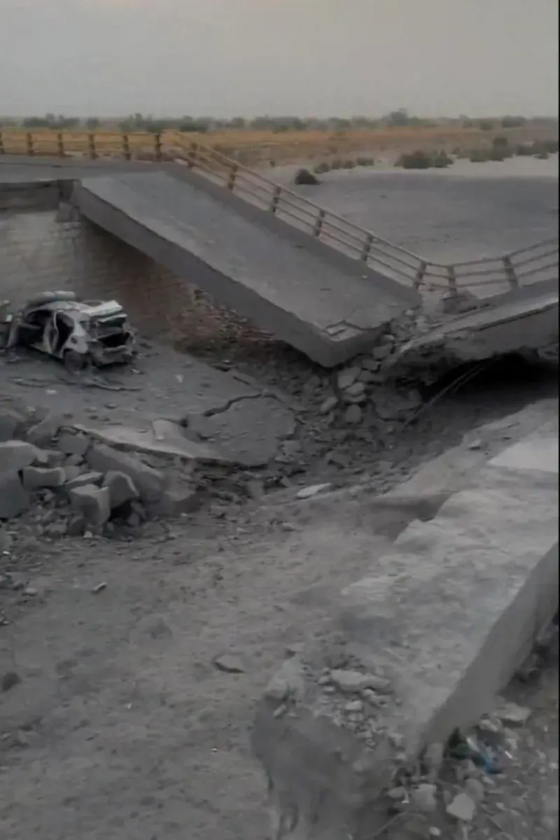 hormozgan-bridge-damage-us-strikesA damaged bridge and wrecked vehicle in Hormozgan province following overnight US strikes.