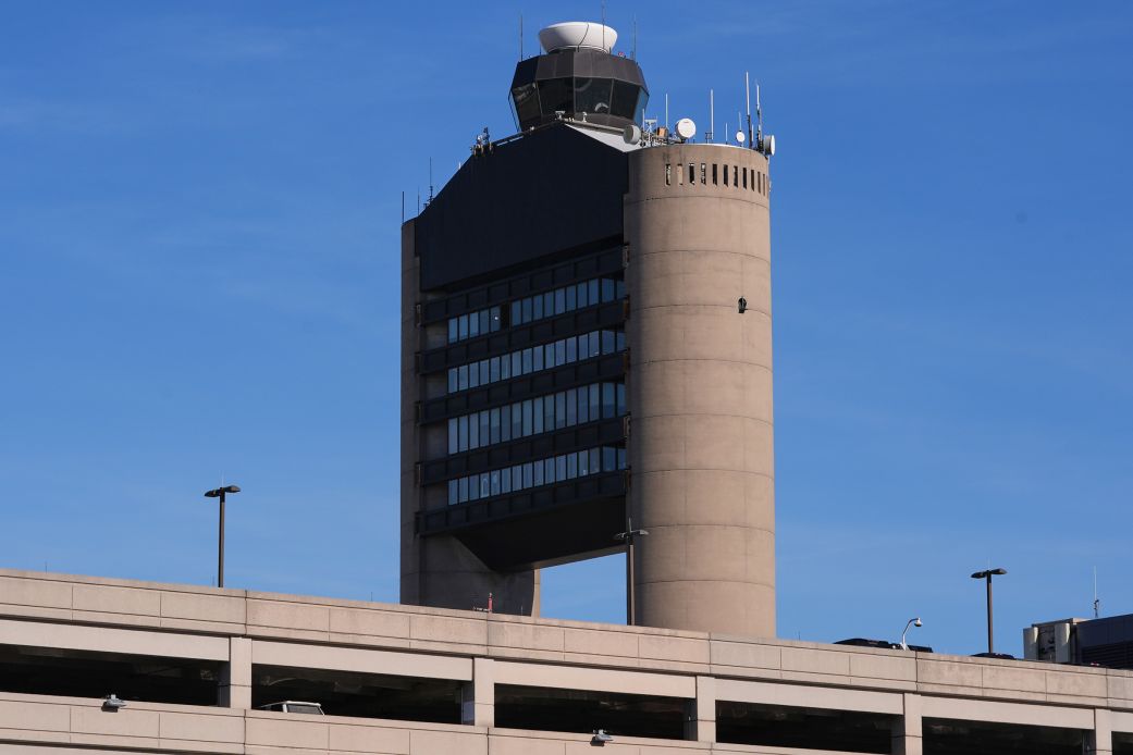 Two planes nearly collided in Boston after a false alarm and a controller forgot who he cleared for takeoff, the NTSB reports
